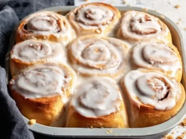 Delicious homemade cinnamon rolls freshly baked and topped with icing