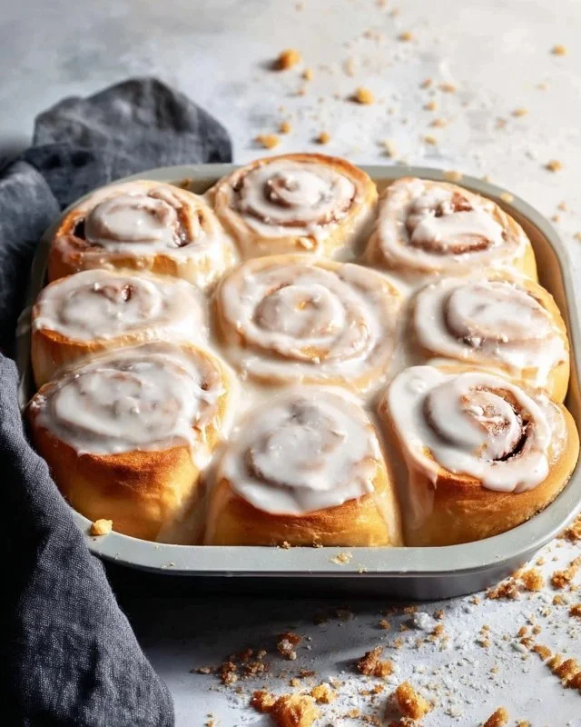 Delicious homemade cinnamon rolls freshly baked and topped with icing