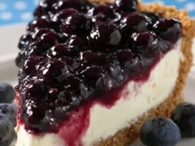 Blueberry Cream Pie topped with fresh blueberries and cream