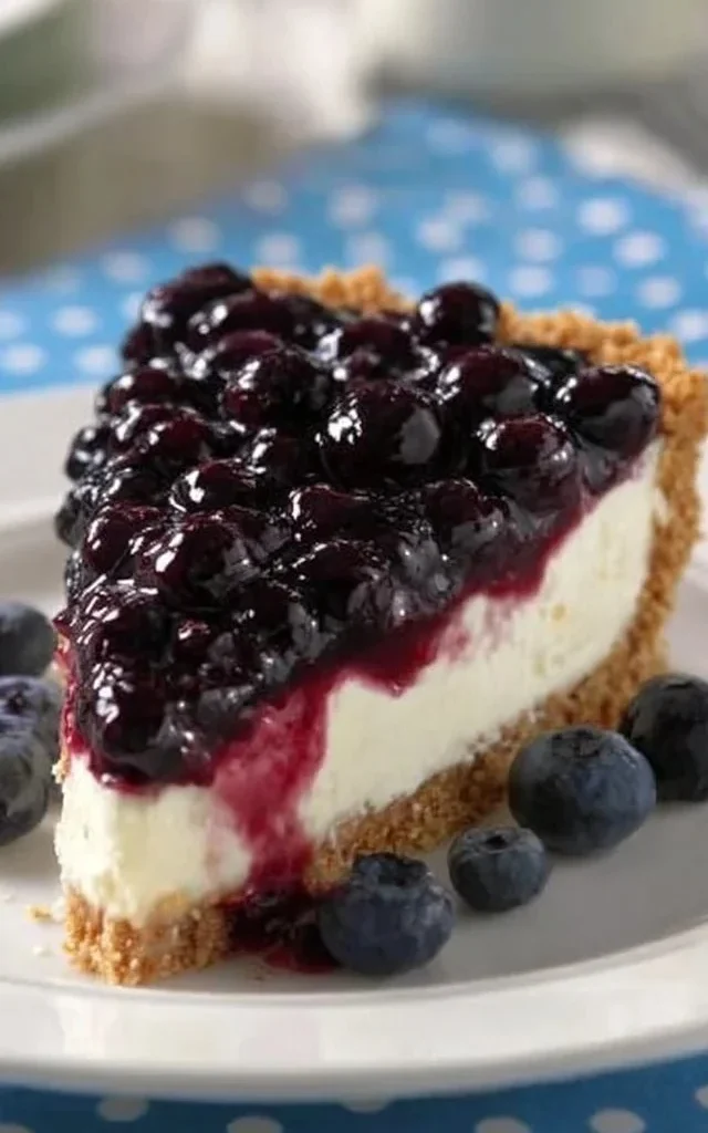 Blueberry Cream Pie topped with fresh blueberries and cream