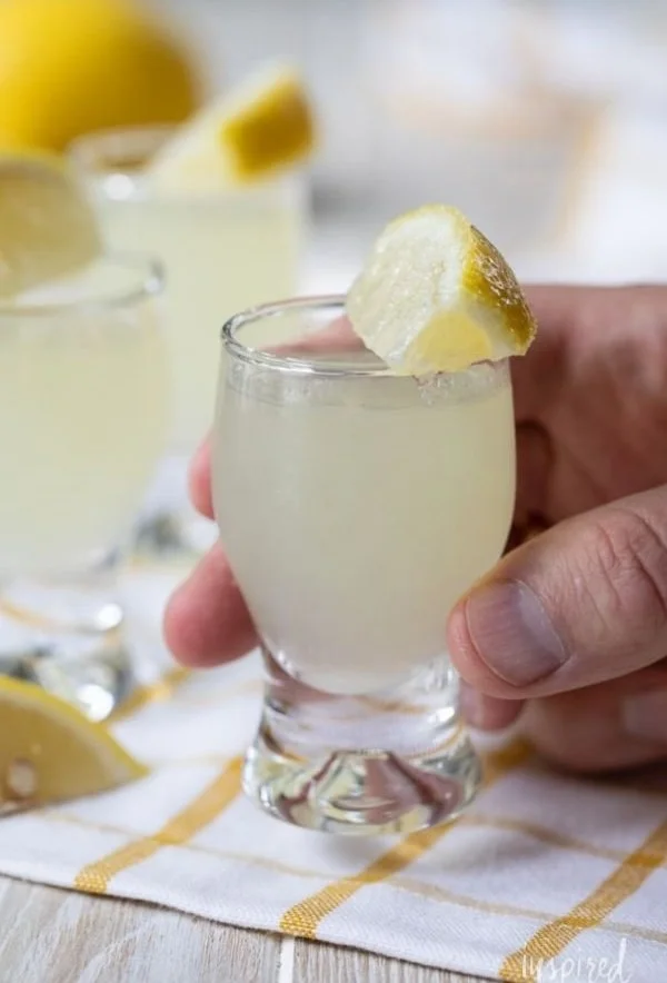 Classic lemon drop shot cocktail served in a glass with a lemon slice