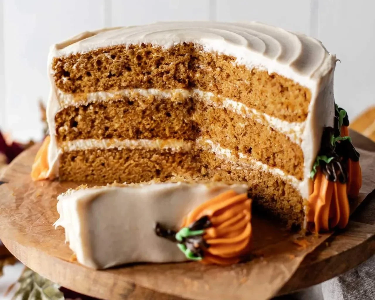 Perfectly baked Pumpkin Cake topped with cream frosting and spices