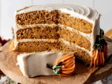 Perfectly baked Pumpkin Cake topped with cream frosting and spices