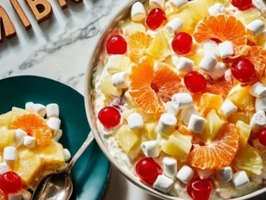 Bowl of colorful Ambrosia Salad with fruits and marshmallows
