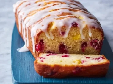 Freshly baked cranberry orange bread with cranberries and orange zest