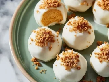No bake pumpkin cheesecake balls on a decorative plate