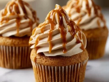 Delicious Pumpkin Cupcakes with caramel and peanut butter frosting