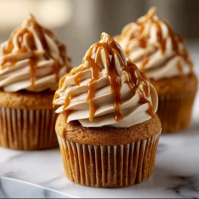 Delicious Pumpkin Cupcakes with caramel and peanut butter frosting