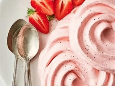 Delicious strawberry buttercream frosting on a cake