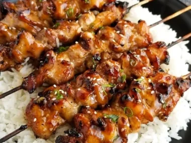 Grilled Teriyaki Chicken Skewers with colorful vegetables on a platter