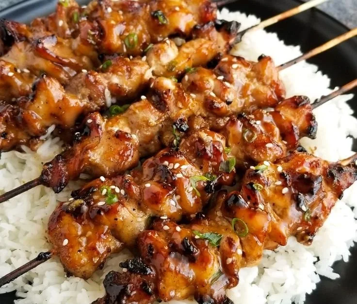 Grilled Teriyaki Chicken Skewers with colorful vegetables on a platter