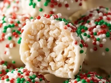 Delicious White Chocolate Rice Krispie Balls adorned with colorful holiday sprinkles