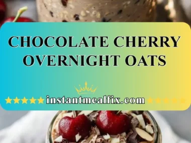 Delicious chocolate cherry overnight oats in a bowl topped with fresh cherries