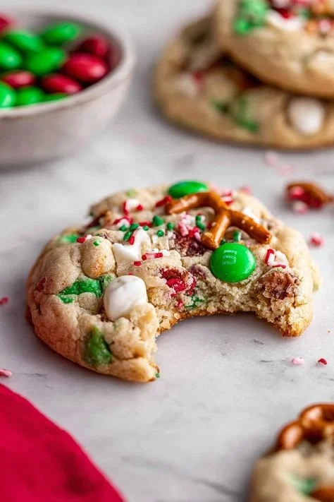 A batch of colorful Christmas kitchen sink cookies on a festive plate.