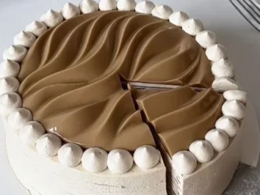 Slice of Coconut Latte Crepe Cake with coconut flakes and a latte flavor