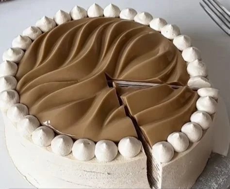 Slice of Coconut Latte Crepe Cake with coconut flakes and a latte flavor