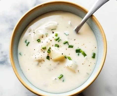 Creamy horseradish sauce served in a bowl with fresh herbs