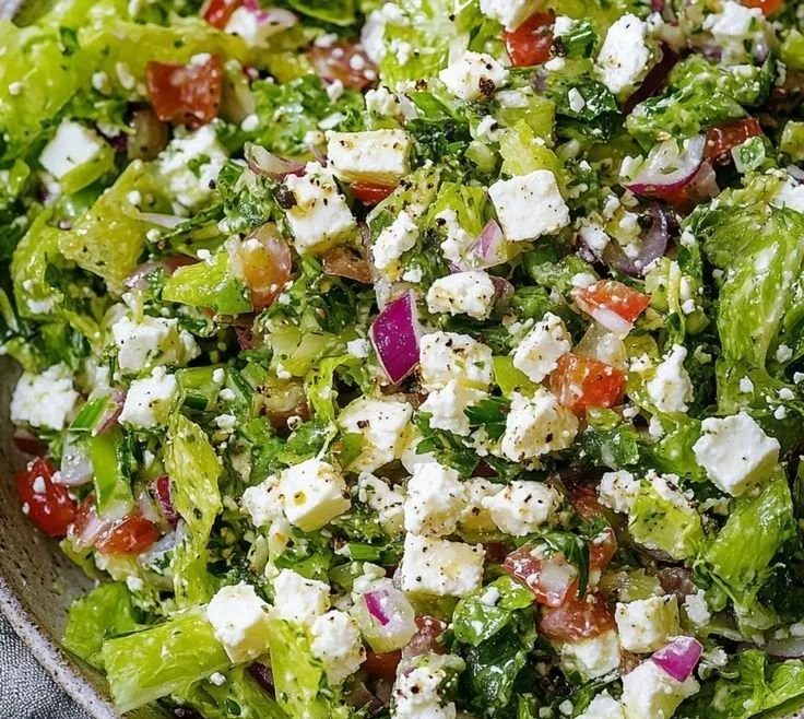 Delicious feta chopped salad with fresh vegetables and feta cheese