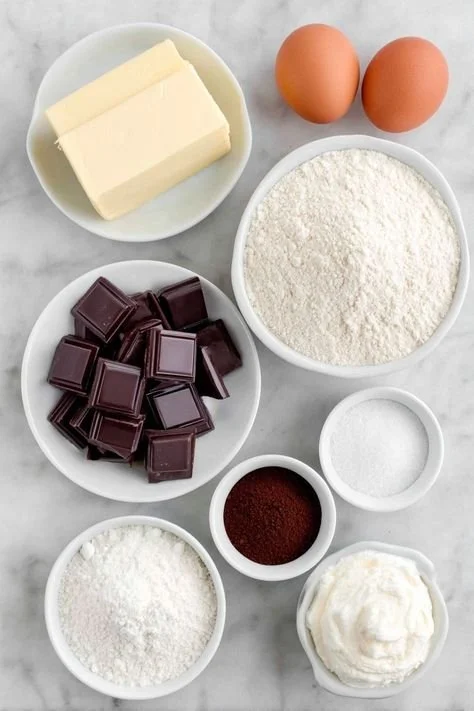 Decadent hot chocolate brownie with marshmallow frosting on a plate.