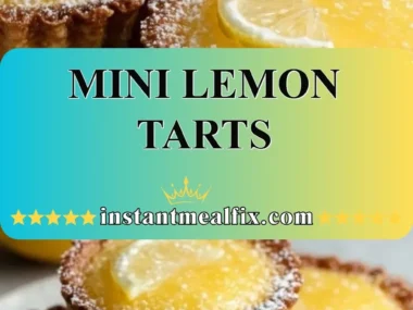 Mini lemon tarts decorated with lemon slices and mint leaves