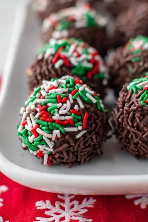 Delicious no-bake chocolate rum balls rolled in coconut and cocoa powder