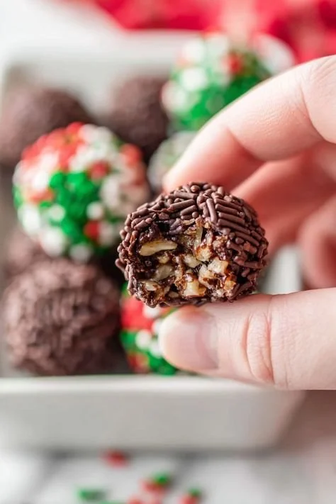 Delicious no bake chocolate rum balls ready to serve at a festive gathering.