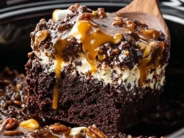Delicious slow cooker chocolate caramel cake topped with rich chocolate sauce.