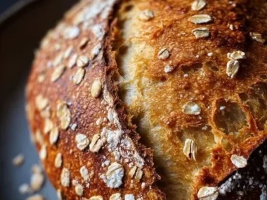 Deliciously soft and chewy honey oat sourdough bread fresh out of the oven.
