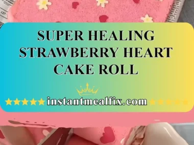 Super Healing Strawberry Heart Cake Roll topped with fresh strawberries and cream