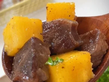 Delicious Black Pepper Pineapple Beef Bites on a wooden platter