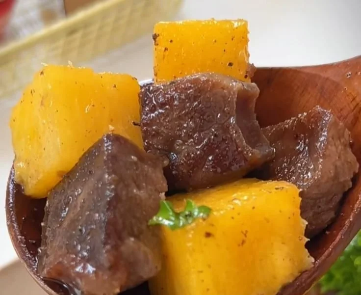Delicious Black Pepper Pineapple Beef Bites on a wooden platter