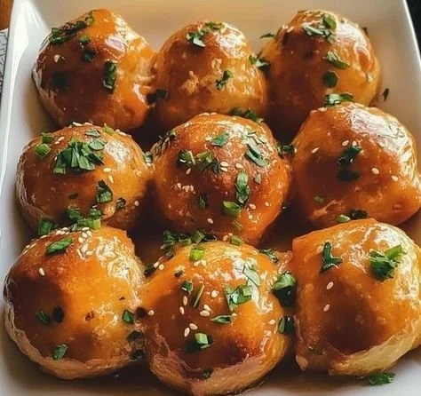 Air Fryer Buffalo Chicken Bombs cooked to golden perfection with spicy sauce