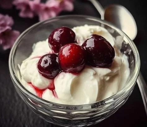 Delicious Cherry Yogurt Parfait with cherries, yogurt, and granola