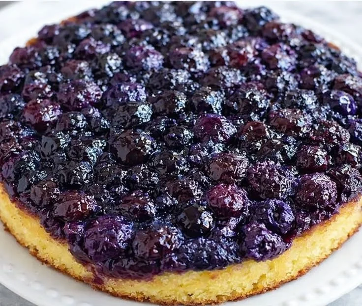 Homemade blueberry upside down cake with fresh blueberries and caramel topping