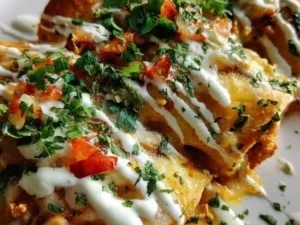 Delicious low-carb white chicken enchiladas topped with creamy sauce