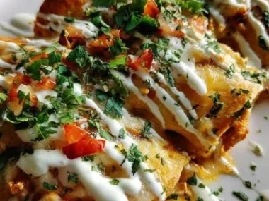 Delicious low-carb white chicken enchiladas topped with creamy sauce