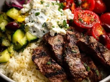 Delicious Mediterranean steak bowls with vibrant vegetables and sauces.