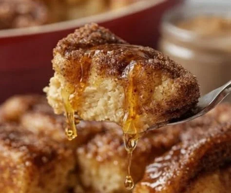 Delicious Overnight French Toast Bake topped with syrup and fresh fruit