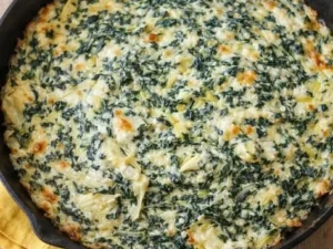 Delicious Spinach Artichoke Dip served in a bowl with tortilla chips