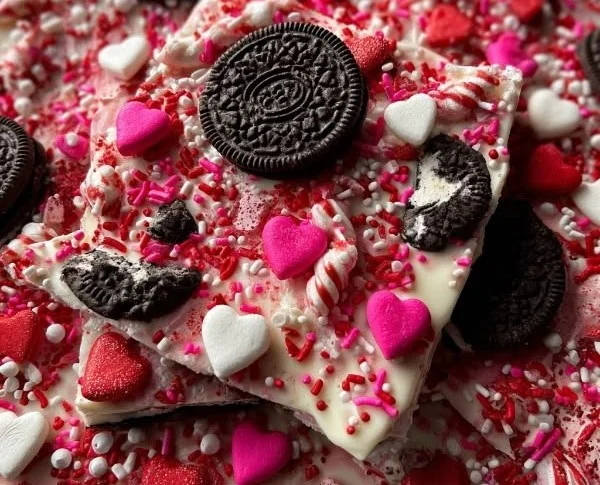No-bake Valentine's Day Oreo Cookie Bark topped with heart-shaped sprinkles.