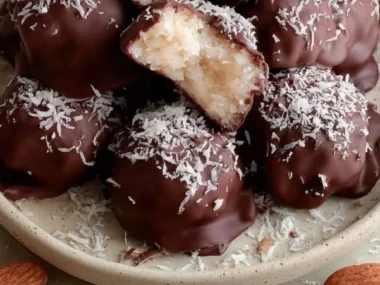 Almond Joy Coconut Bites with coconut, almond, and chocolate layers