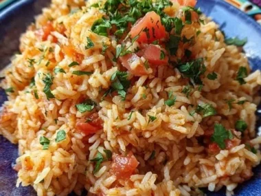 Bowl of authentic spicy fluffy Mexican rice garnished with cilantro