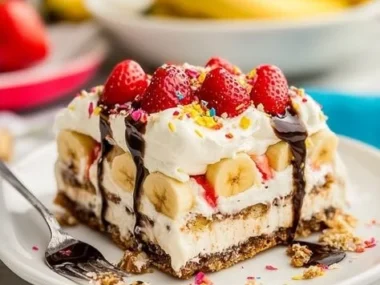 Delicious Banana Split Cake with layers of banana, chocolate, and cream