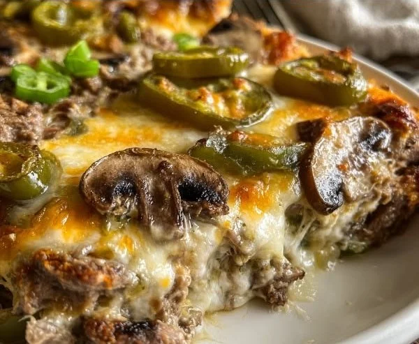 Cheesy low carb Philly cheesesteak casserole served in a dish