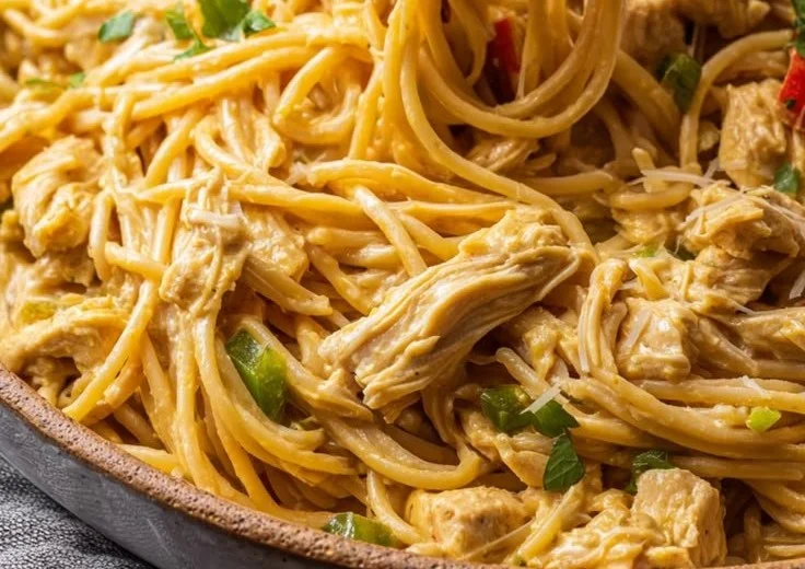 Delicious Chicken Spaghetti served on a plate with garnish