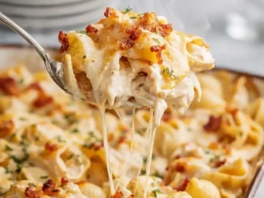Delicious Classic Crack Chicken Casserole topped with cheese and herbs