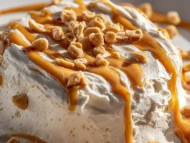 Cottage Cheese Peanut Butter Mousse dessert in a bowl with toppings