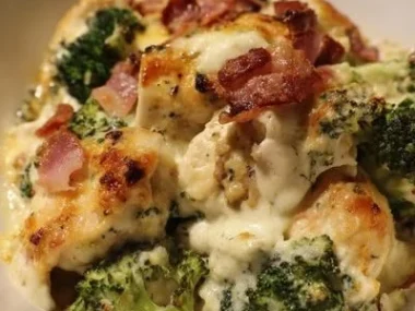 Creamy low carb chicken casserole with broccoli and bacon served in a dish.