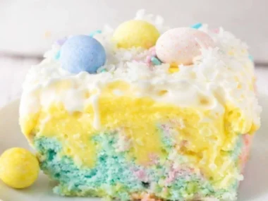 Colorful Easter Poke Cake with festive toppings and pastel colors