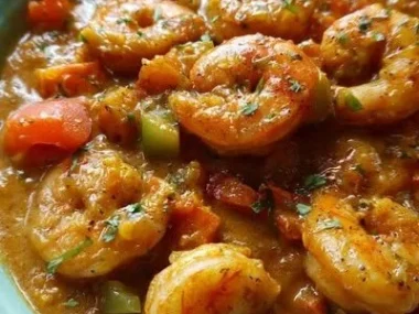 Creamy seafood and shrimp chili served in a bowl with fresh herbs